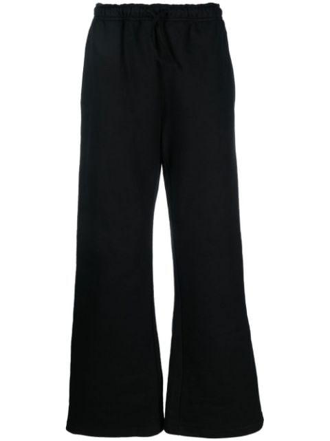 logo-print flared track pants by 032C