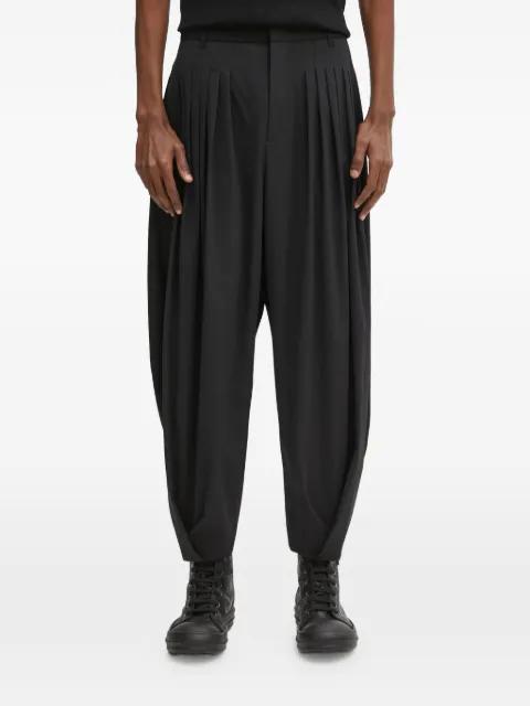 pleated trousers by ADER ERROR