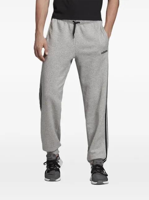 stripes essentials fleece track pants by ADIDAS