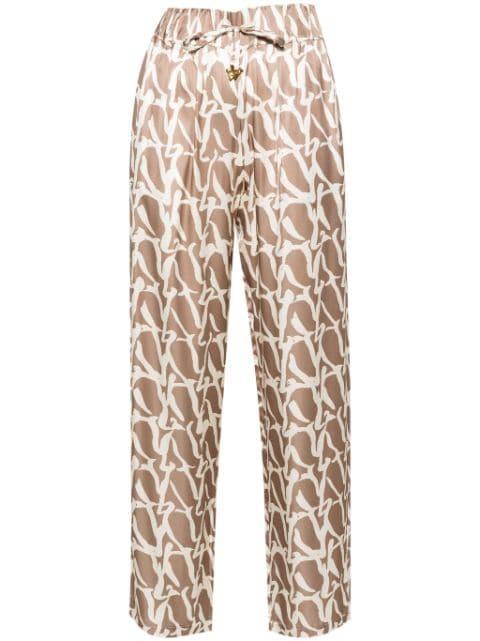 Aurora monogram-print drawstring trousers by AERON