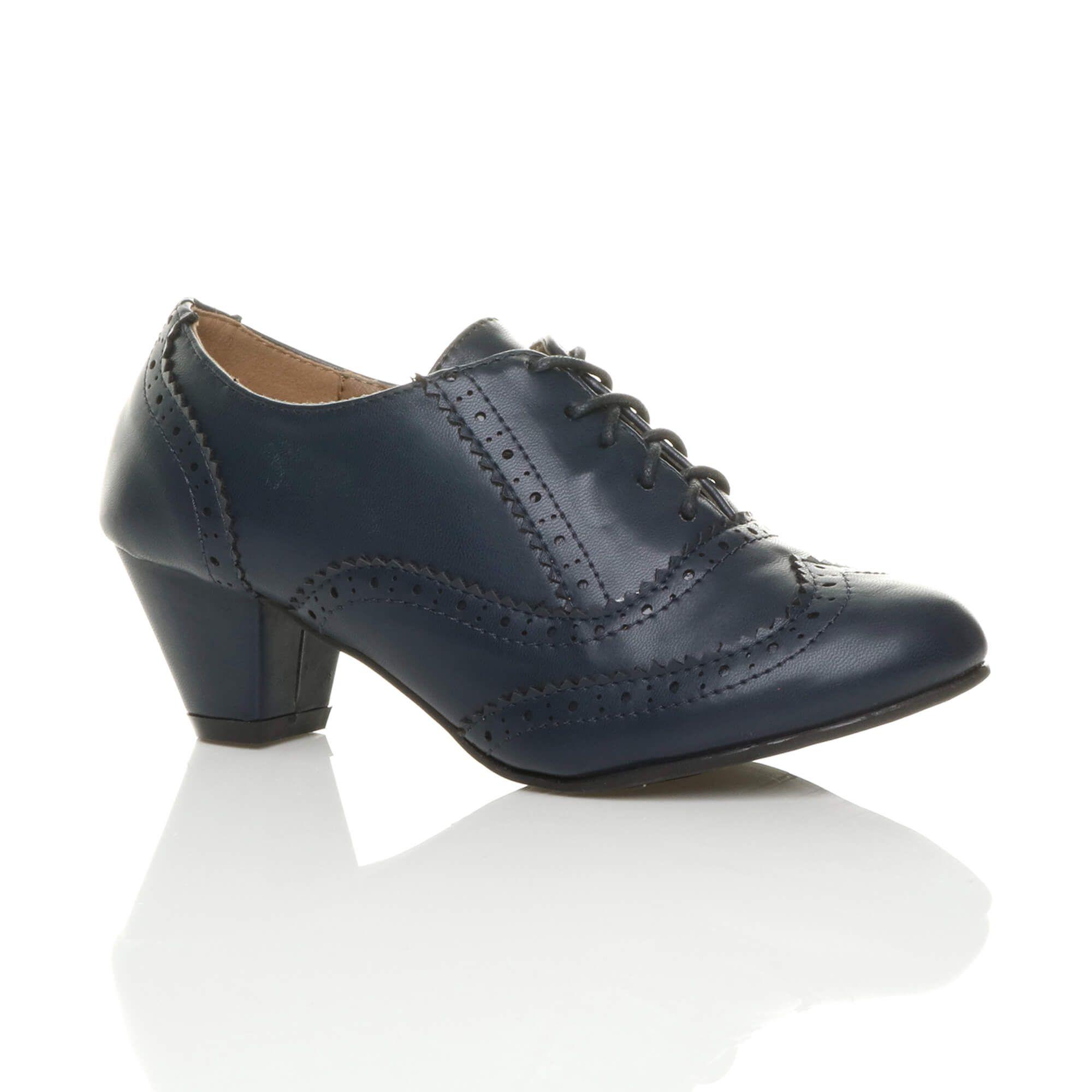 Mid Cuban Heel Brogue Faux Leather Ankle Boots by AJVANI