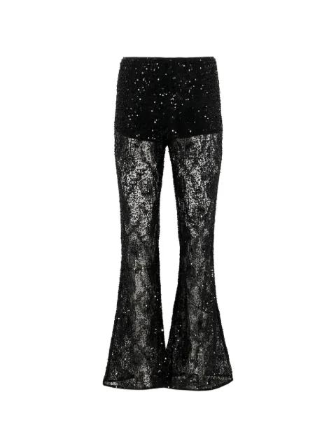 Lennon sequin-embellished lace-patterned trousers by AKNVAS