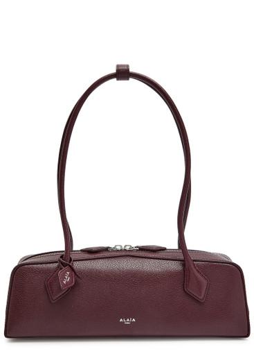 Le Teckel medium grained leather shoulder bag by ALAIA