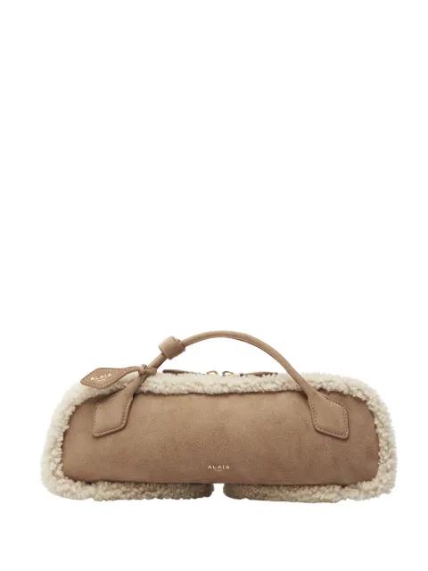 Le Teckel shearling clutch bag by ALAIA