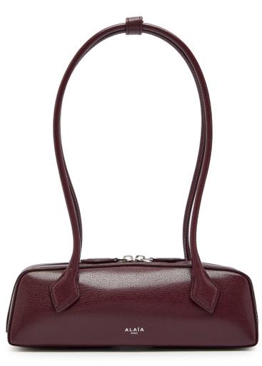 Le Teckel small grained leather shoulder bag by ALAIA