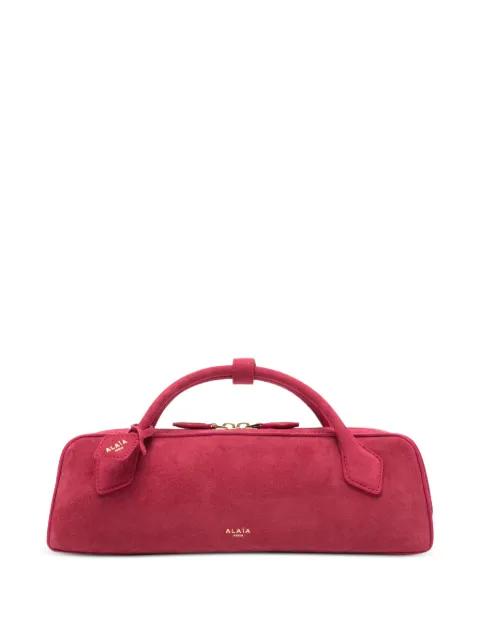 Le Teckel suede clutch bag by ALAIA