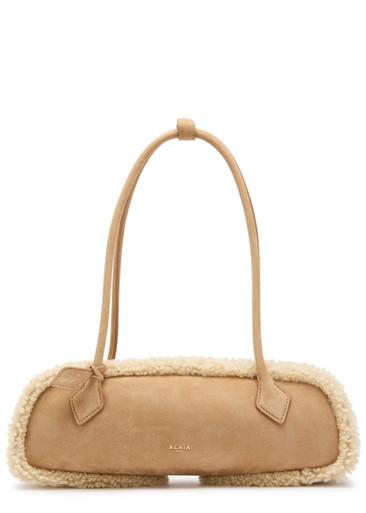 Le Teckle medium shearling-trimmed suede shoulder bag by ALAIA