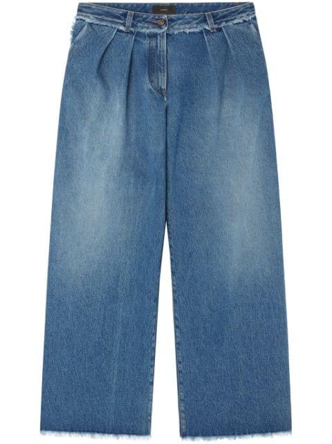 fringed wide leg jeans by ALANUI