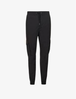 Elasticated-waistband regular-fit tapered-leg shell jogging bottoms by ALPHA INDUSTRIES