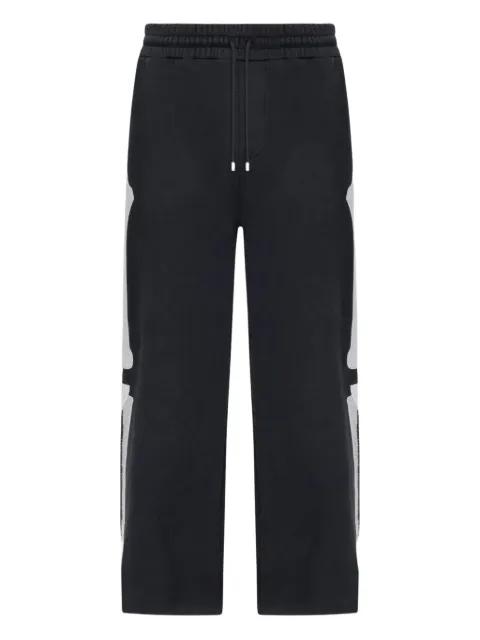 Bones track pants by AMIRI