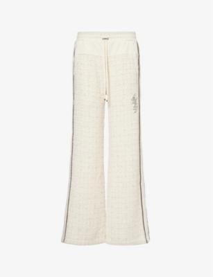 Bouclé-panel brand-embroidered woven trousers by AMIRI