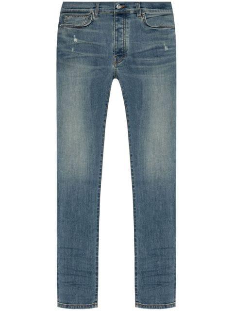 Stack low-rise skinny jeans by AMIRI