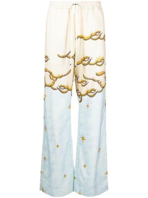 Sunscape-print flared trousers by AMIRI