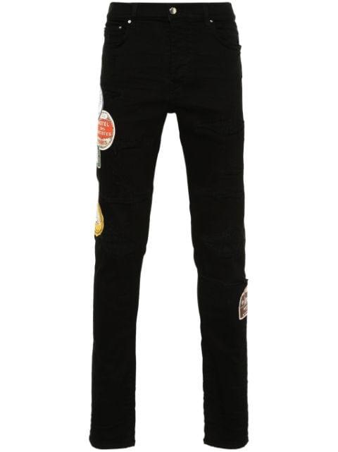 Travel Patch Repair skinny jeans by AMIRI