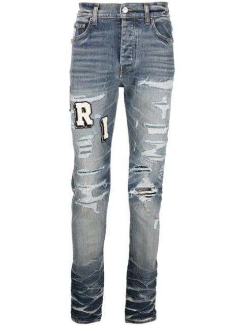 Varsity ripped skinny jeans by AMIRI