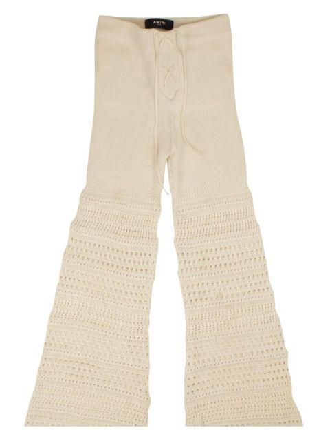 crochet flared trousers by AMIRI