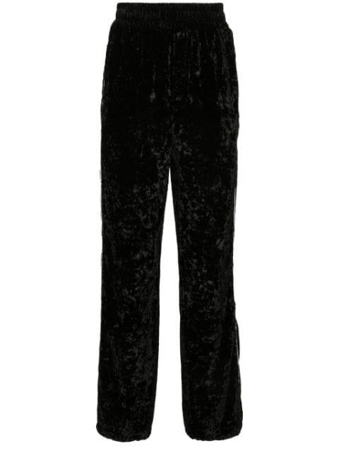 crushed velvet track pants by AMIRI