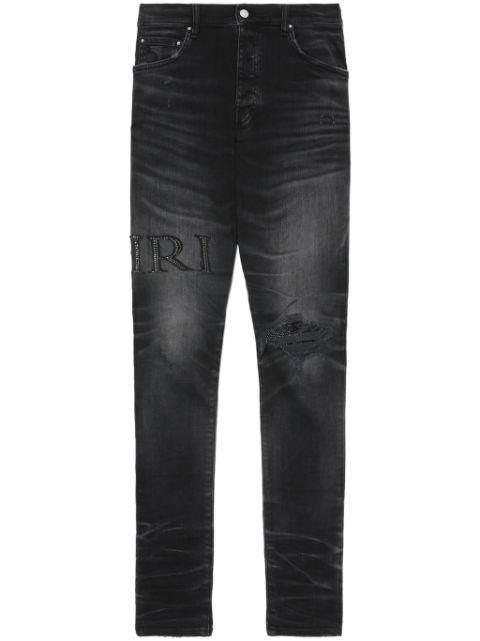 crystal-embellished skinny jeans by AMIRI