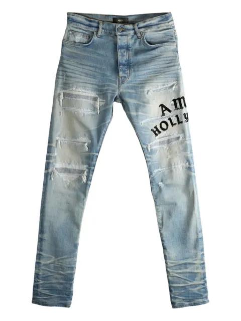 distressed embroidered jeans by AMIRI