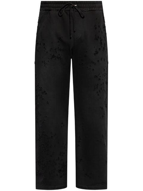 distressed-finish track pants by AMIRI