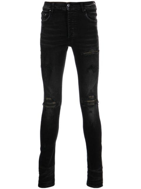distressed skinny jeans by AMIRI