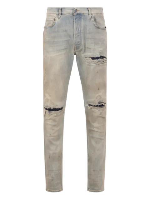 distressed skinny jeans by AMIRI