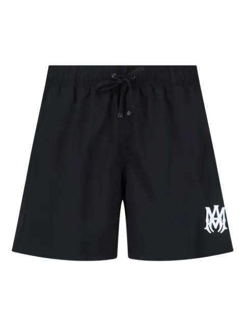 drawstring logo swim shorts by AMIRI