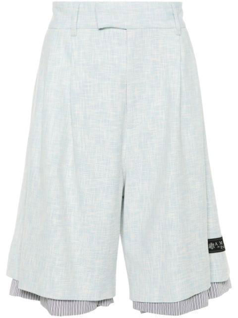 layered bermuda shorts by AMIRI