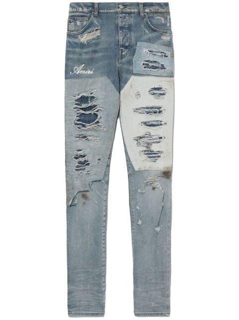logo-print distressed jeans by AMIRI