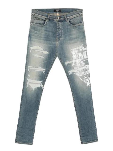 ripped print jeans by AMIRI