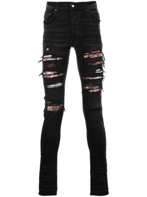 ripped skinny jeans by AMIRI