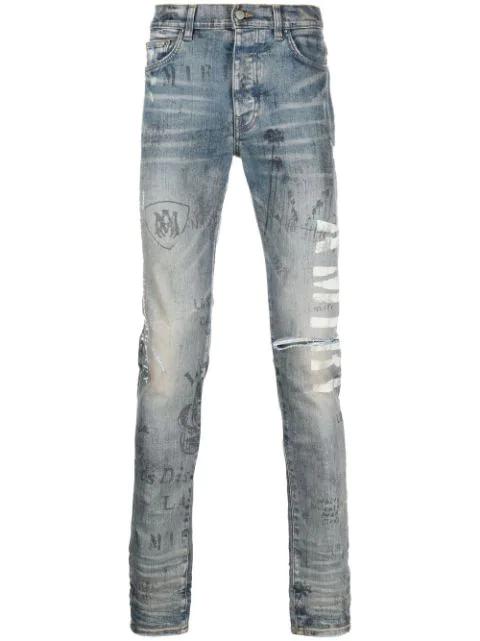 slim-fit illustration print jeans by AMIRI