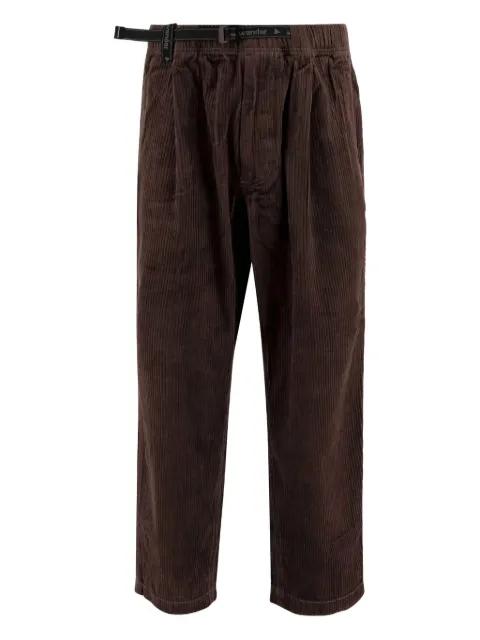 belted corduroy trousers by AND WANDER