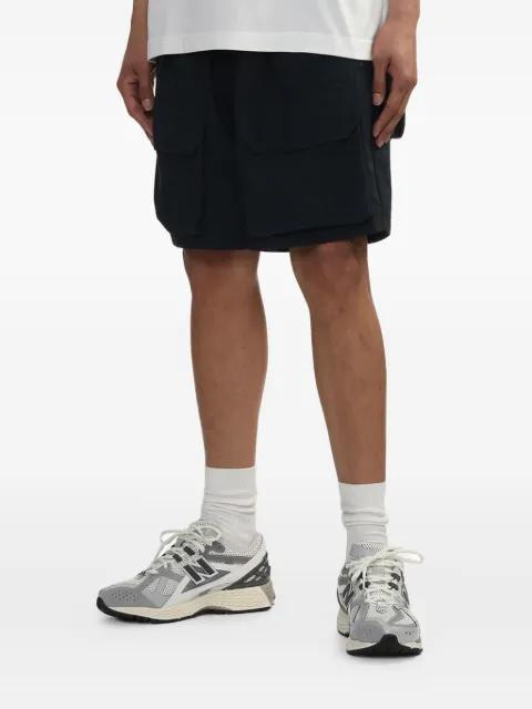 belted shorts by AND WANDER