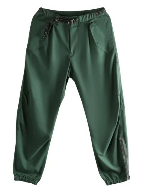 belted-waist track pants by AND WANDER