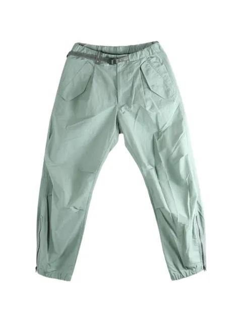belted zip-cuff trousers by AND WANDER