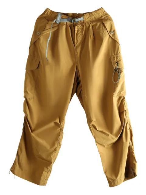 cargo-pocket trousers by AND WANDER