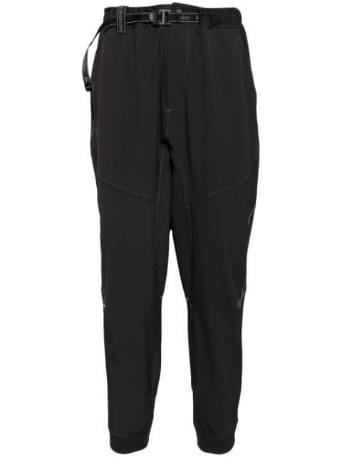 water-repellent tapered trousers by AND WANDER
