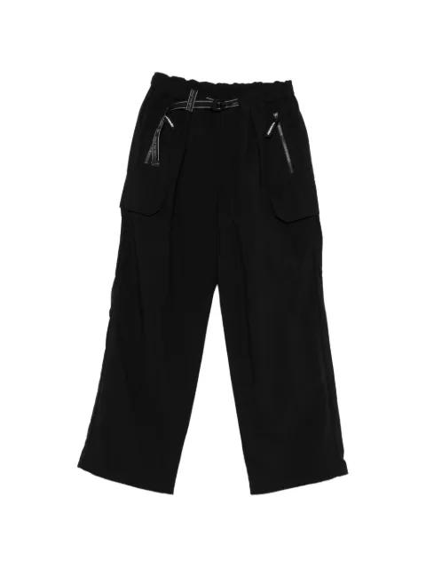 zip pocket trousers by AND WANDER