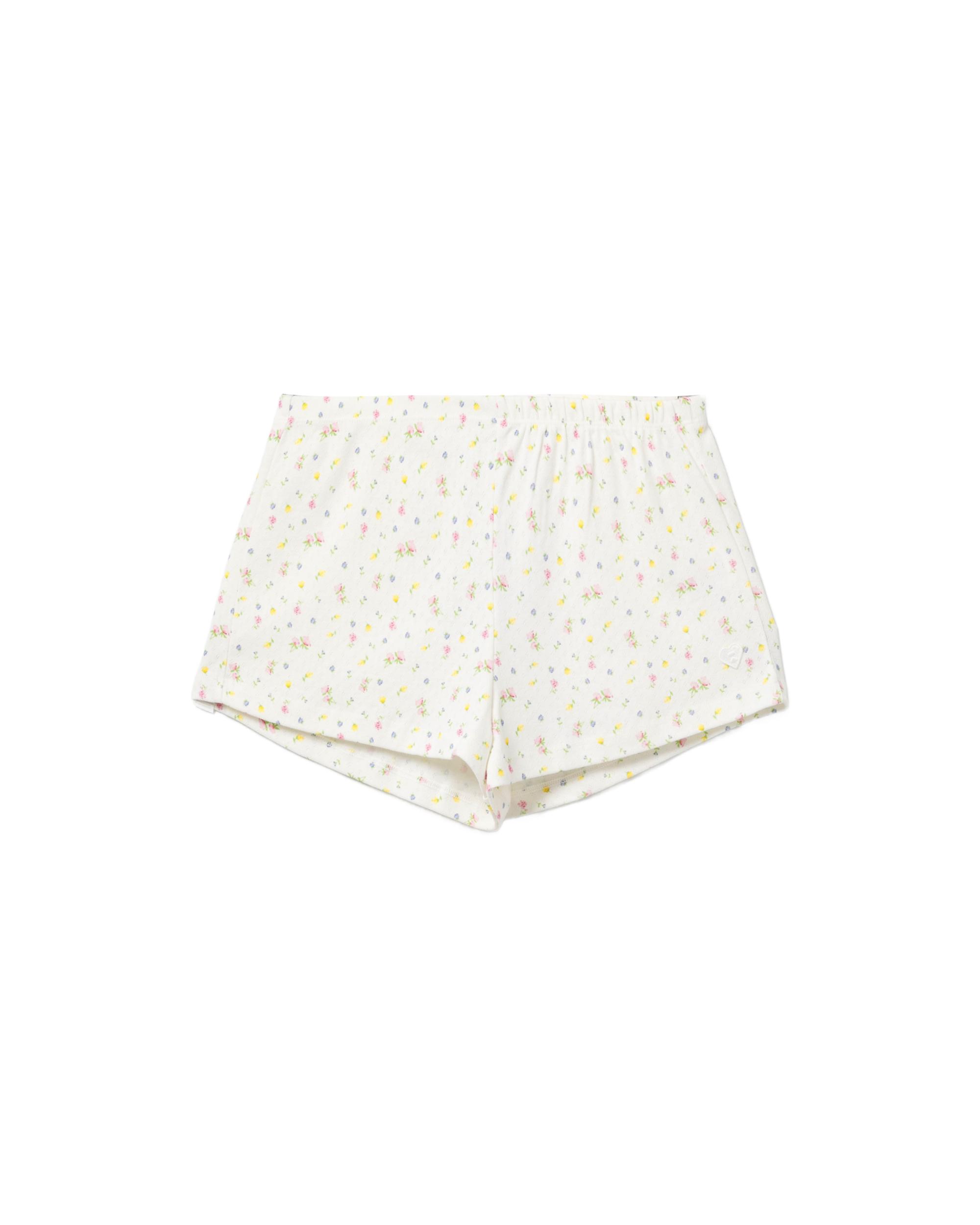 Heart badge floral print shorts by APEE