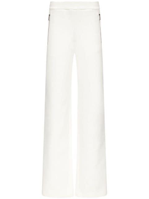 embossed handprint track pants by AREA