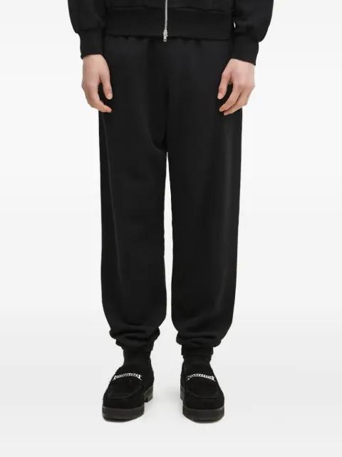 embroidered cuffed track pants by ARIES