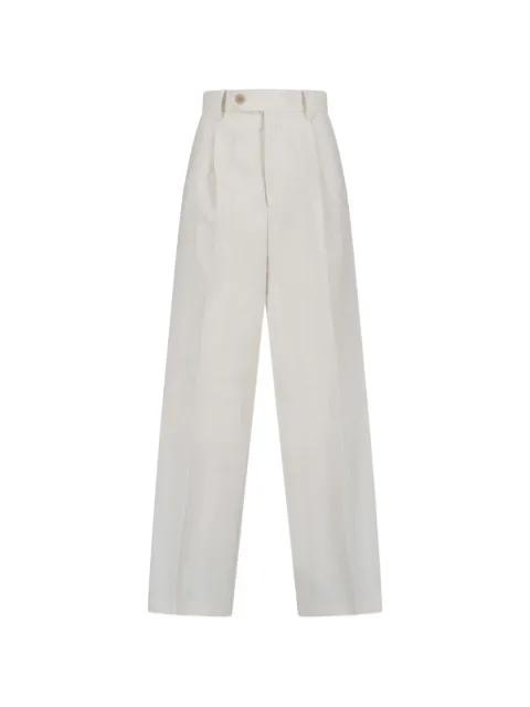 pleated tailored trousers by AURALEE