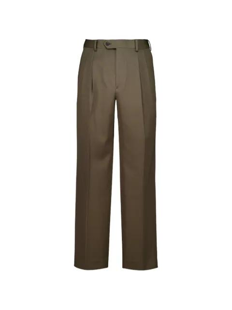 pleated wool trousers by AURALEE