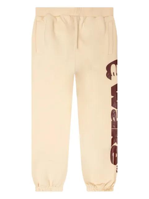 apple-print drawstring track pants by AWAKE NY