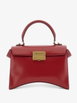Hourglass Avenue top handle bag small in carmin red by BALENCIAGA Hourglass Avenue top handle bag small in carmin red by BALENCIAGA