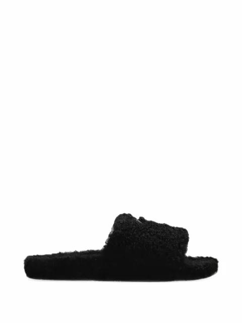 furry open mules in black by BALENCIAGA