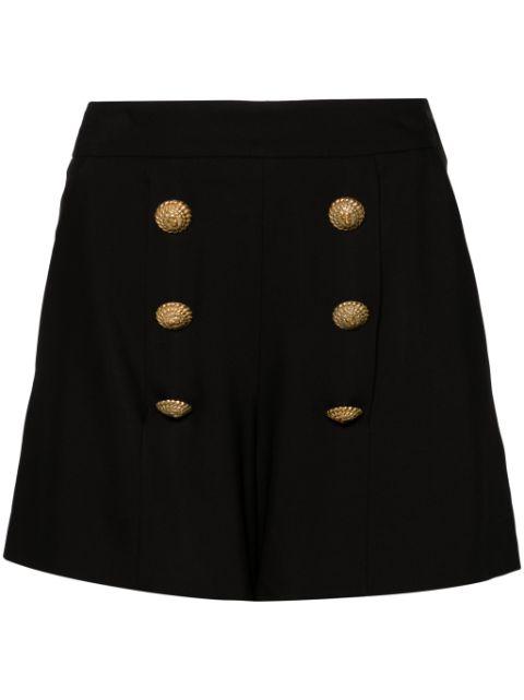 button-embellished shorts by BALMAIN