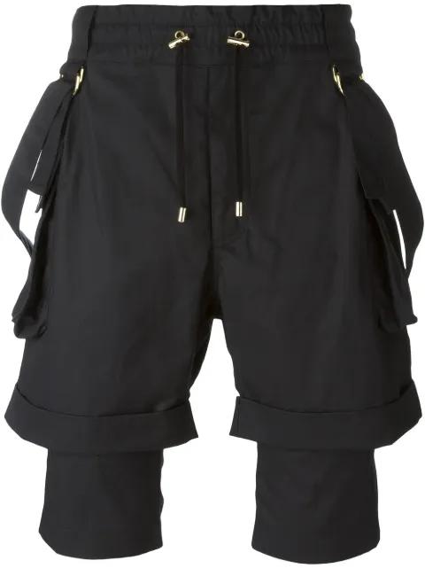 layered cargo shorts by BALMAIN