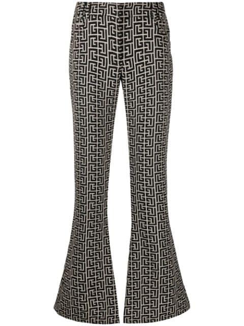 low-rise monogram bootcut trousers by BALMAIN